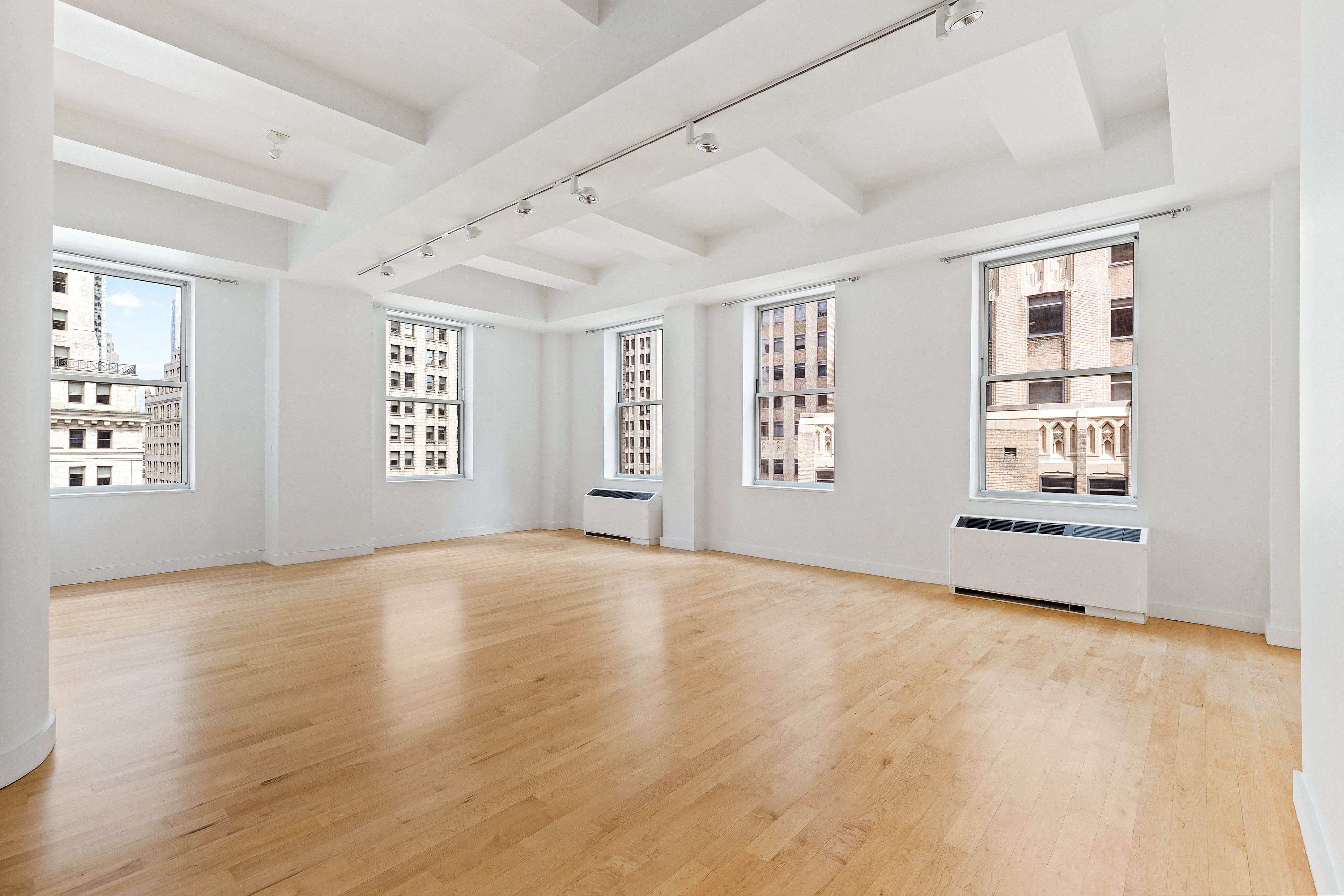 15 Broad Street, Unit 2000 Manhattan, NY 10005 - Photo 1 of 6 a view of an empty room with a window