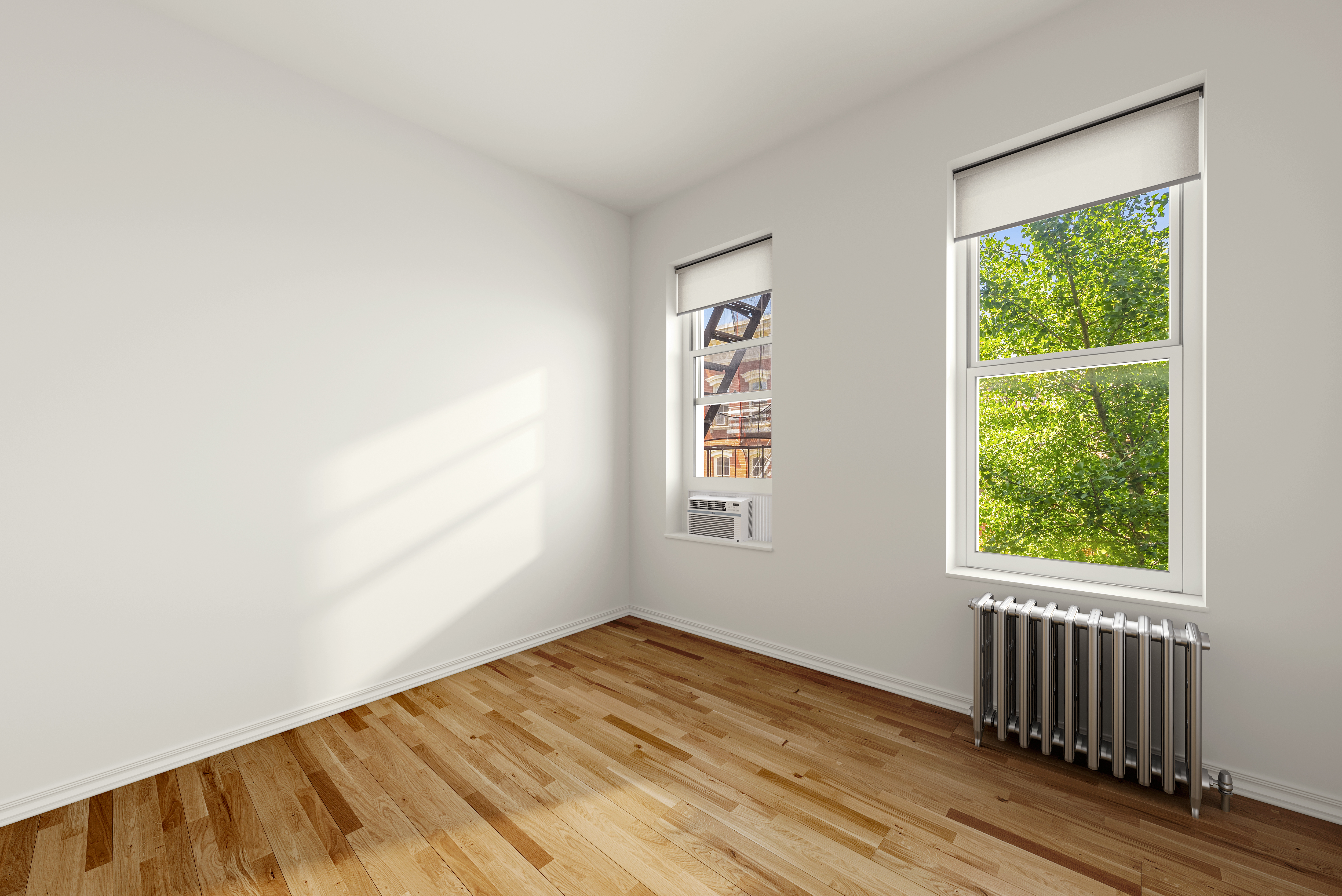 28 Perry Street, Unit 4E Manhattan, NY 10014 - Photo 4 of 9 an empty room with wooden floor and windows