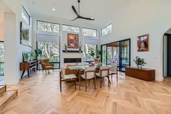 a living room with furniture a window and a flat screen tv