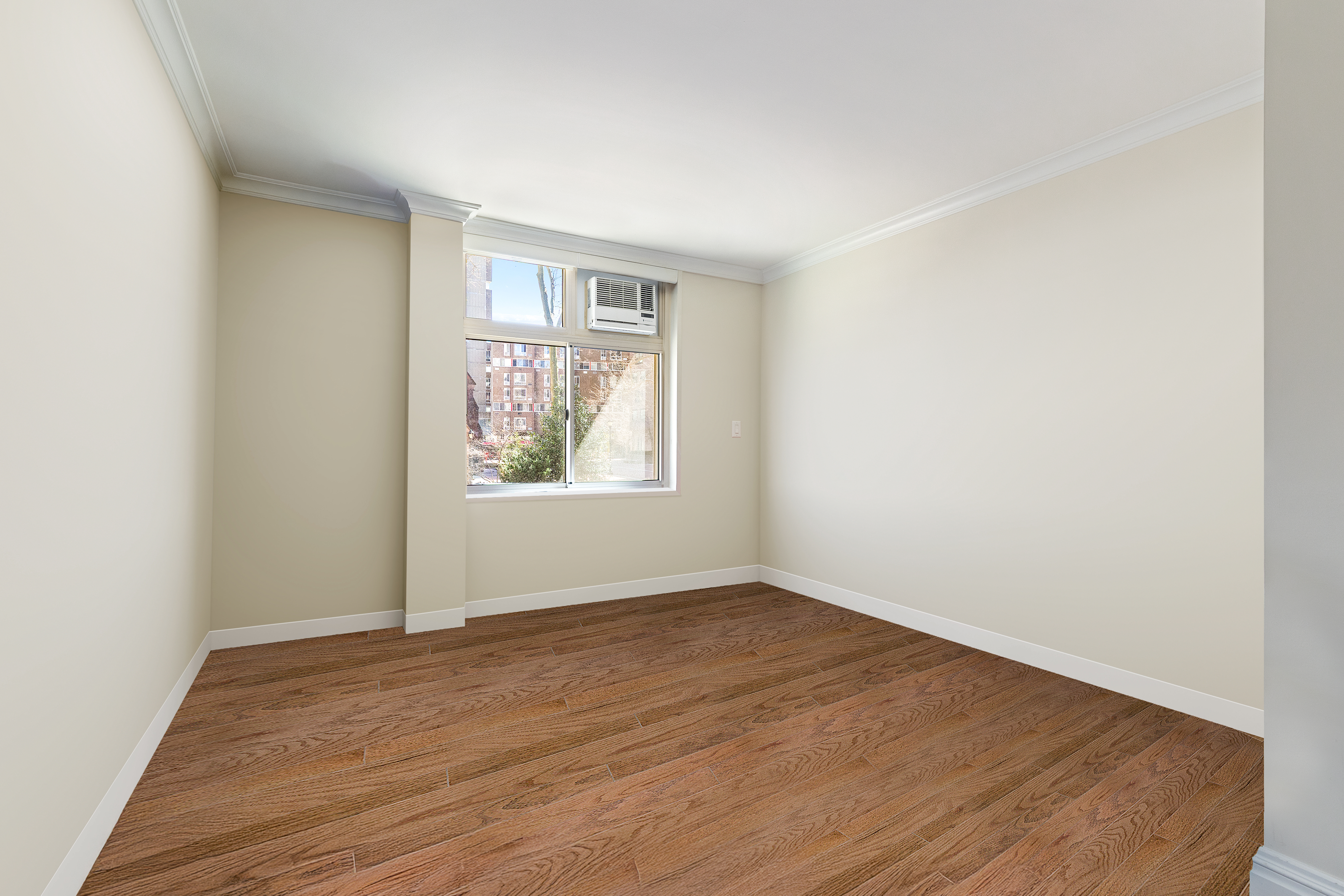 551 Main Street, Unit 208 Manhattan, NY 10044 - Photo 23 of 36 an empty room with wooden floor and windows