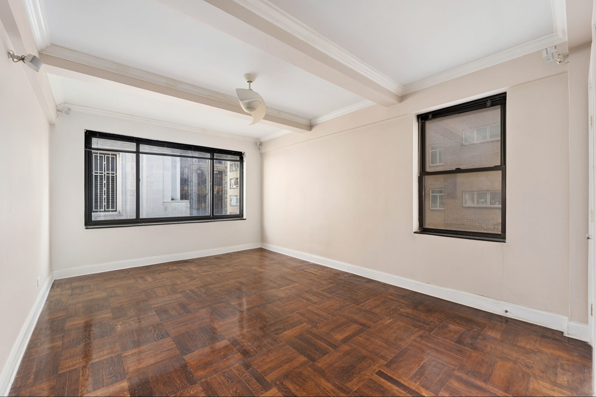 230 Central Park South, Unit 8F Manhattan, NY 10019 - Photo 4 of 7 a view of an empty room with a window