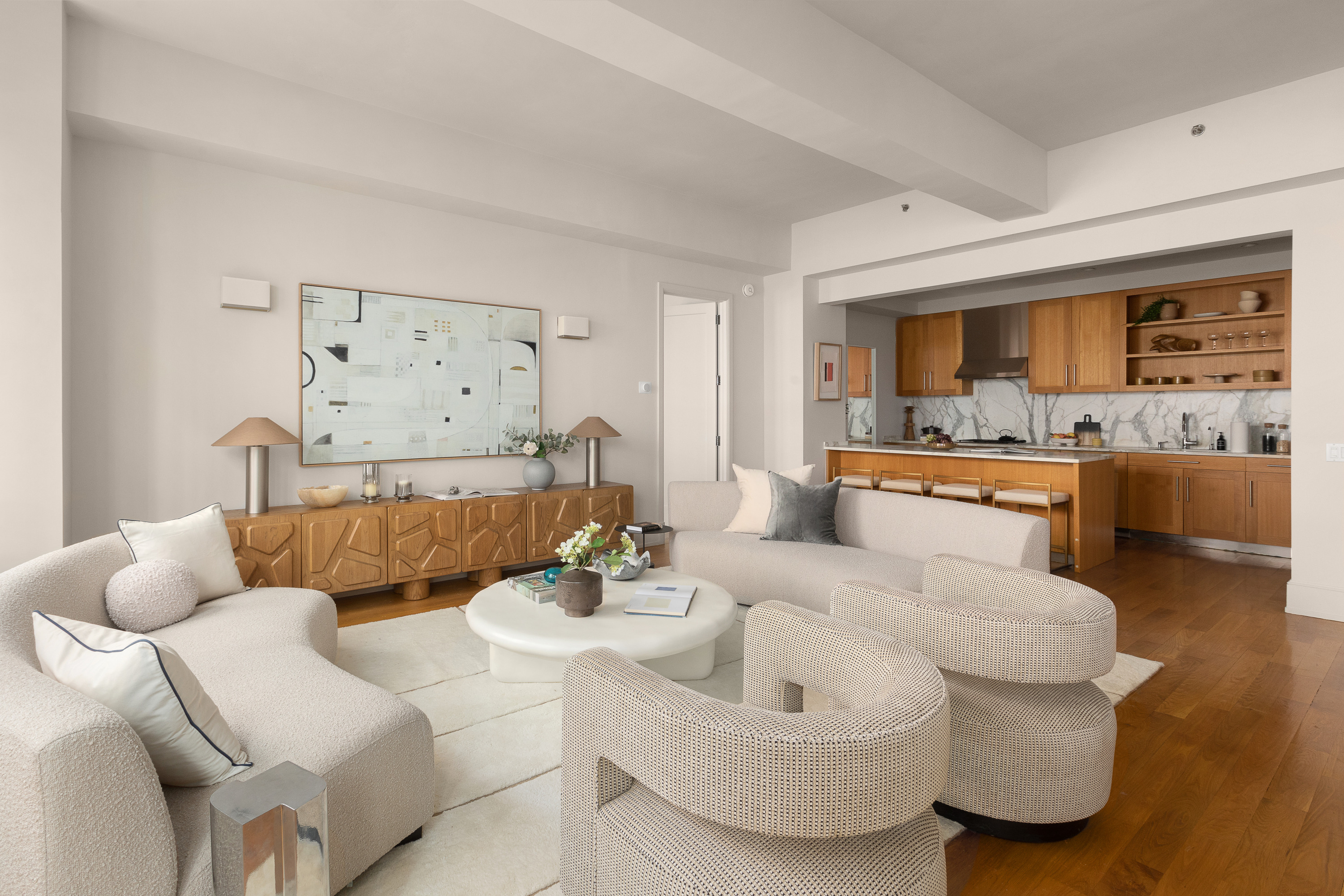 130 West 30th Street, Unit 4C Manhattan, NY 10001 - Photo 2 of 15 a living room with furniture and kitchen view