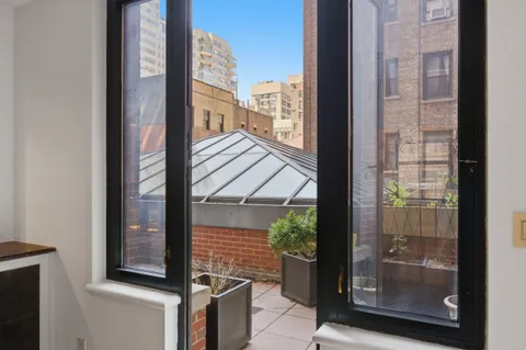 a view of a balcony with a potted plants