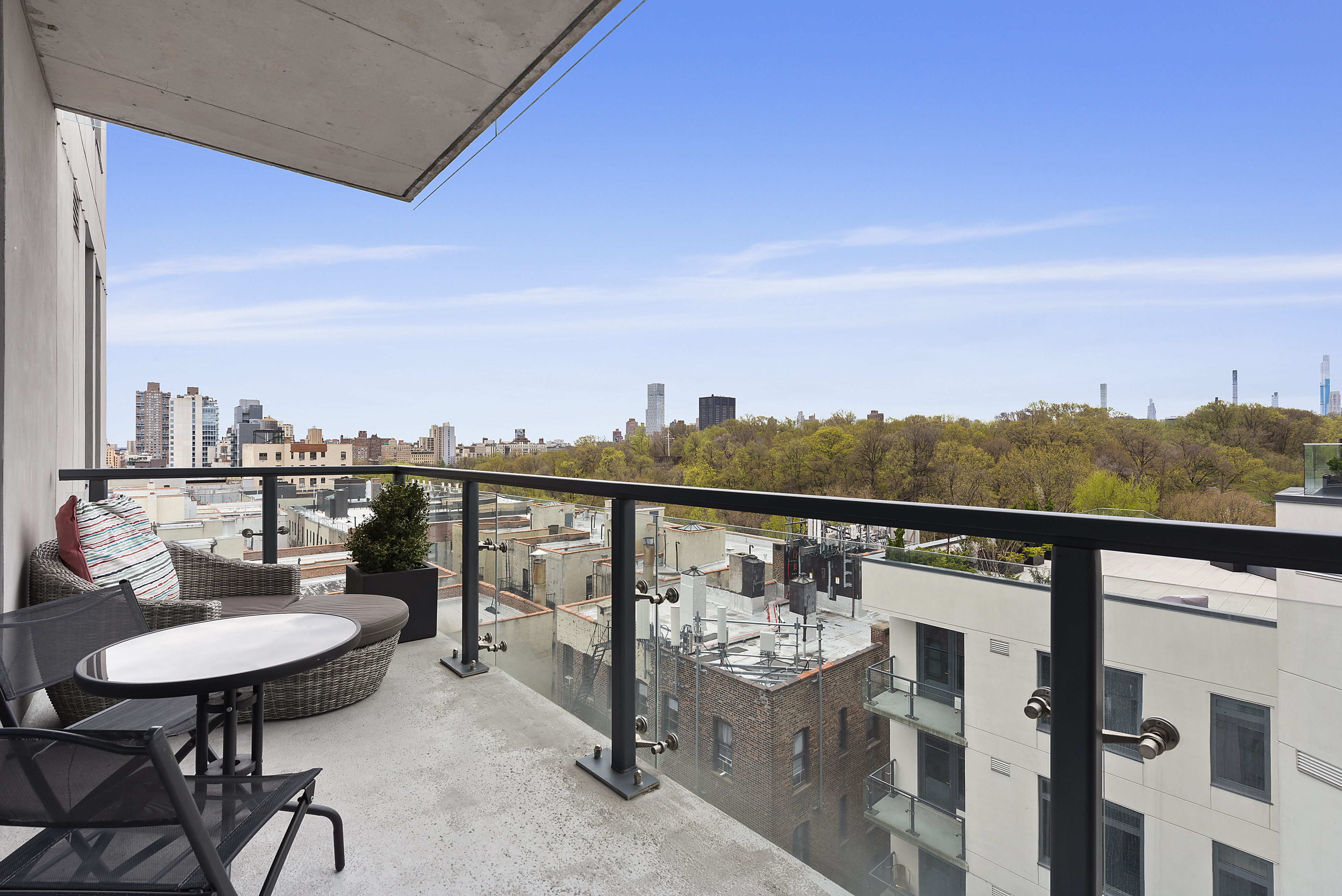 285 West 110th Street, Unit 9B Manhattan, NY 10026 - Photo 4 of 20 a view of a balcony with chairs and a table