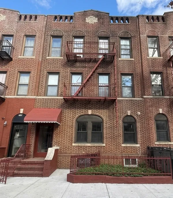 a front view of a multi story residential apartment building