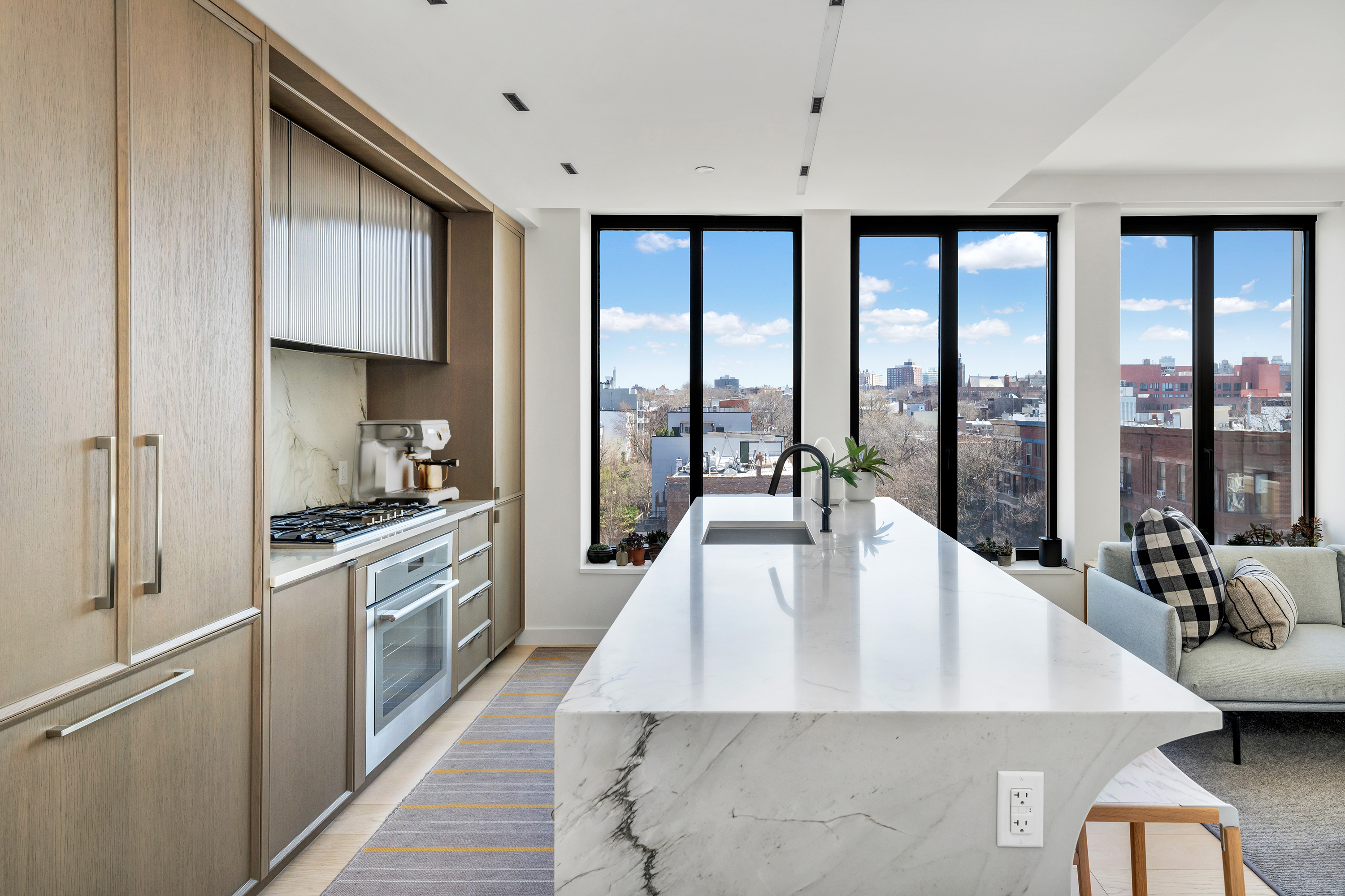 58 St Marks Place, Unit 608 Brooklyn, NY 11217 - Photo 5 of 22 a kitchen with stainless steel appliances granite countertop a stove a sink and a refrigerator