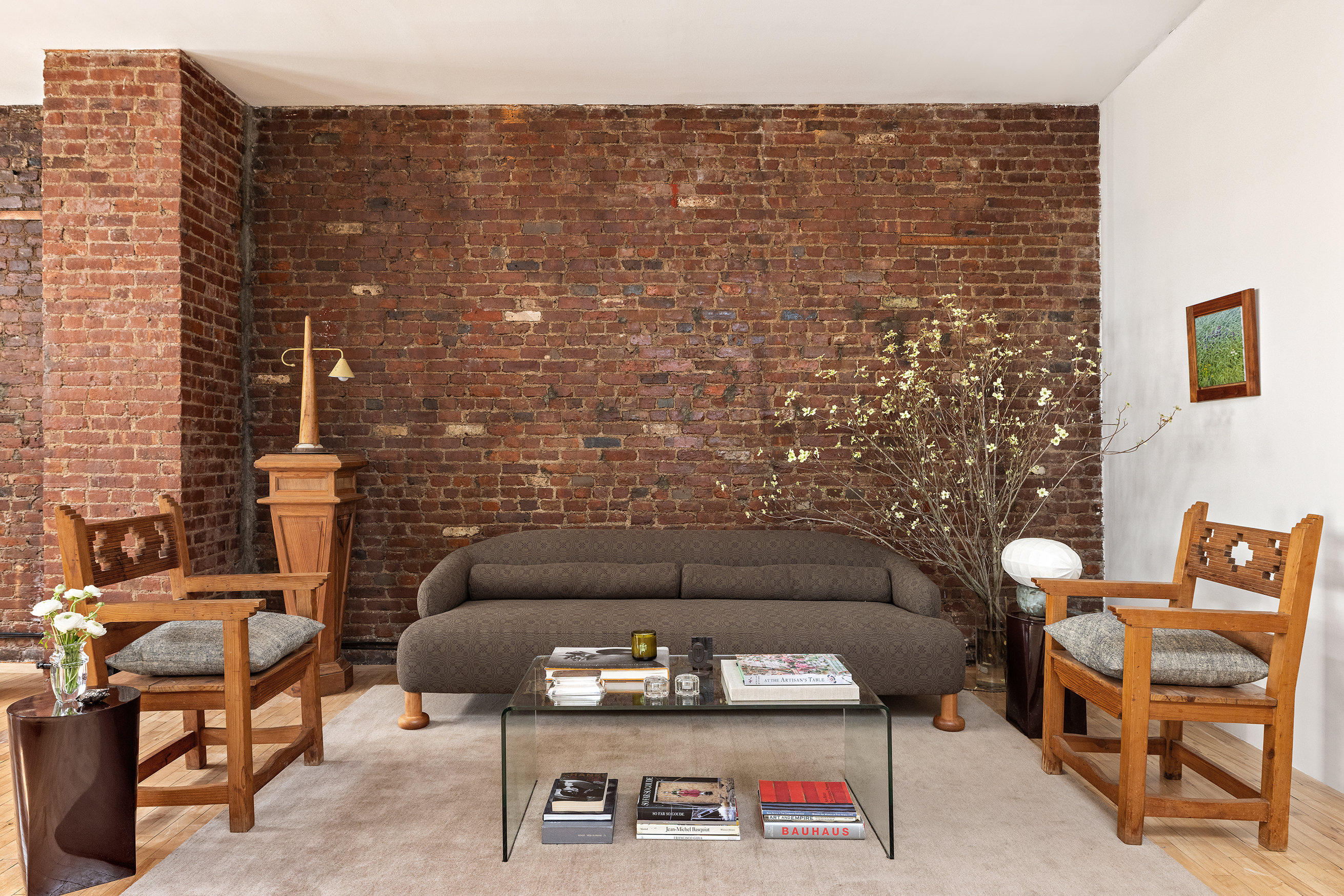 47 Howard Street, Unit PH Manhattan, NY 10013 - Photo 10 of 14 a living room with furniture and a fireplace