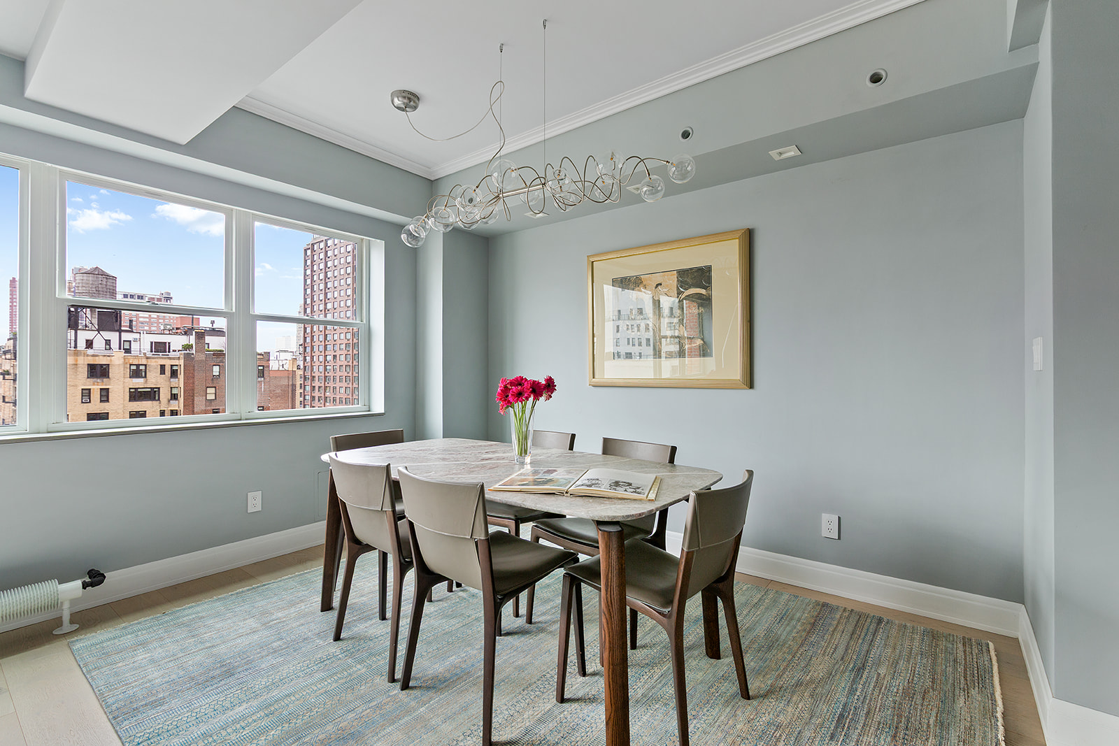 165 East 72nd Street, Unit 17L Manhattan, NY 10021 - Photo 5 of 12 a view of a dining room with furniture window and outside view