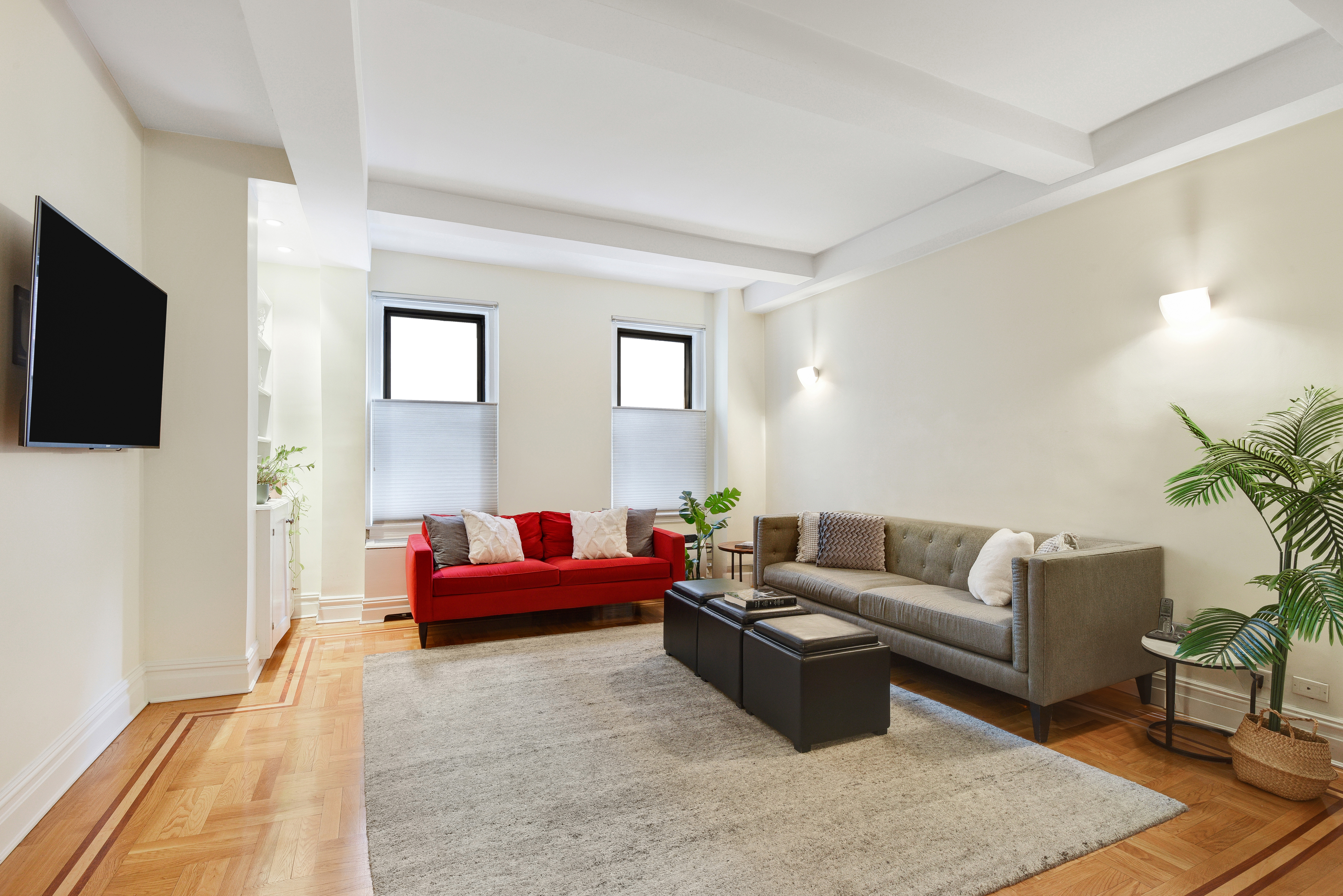 321 West 90th Street, Unit 2F/3F Manhattan, NY 10024 - Photo 3 of 15 a living room with furniture and a flat screen tv