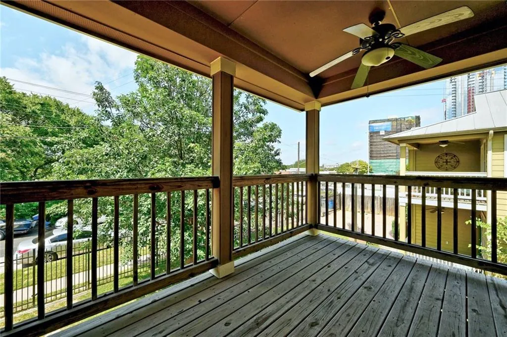 a view of balcony with wooden floor