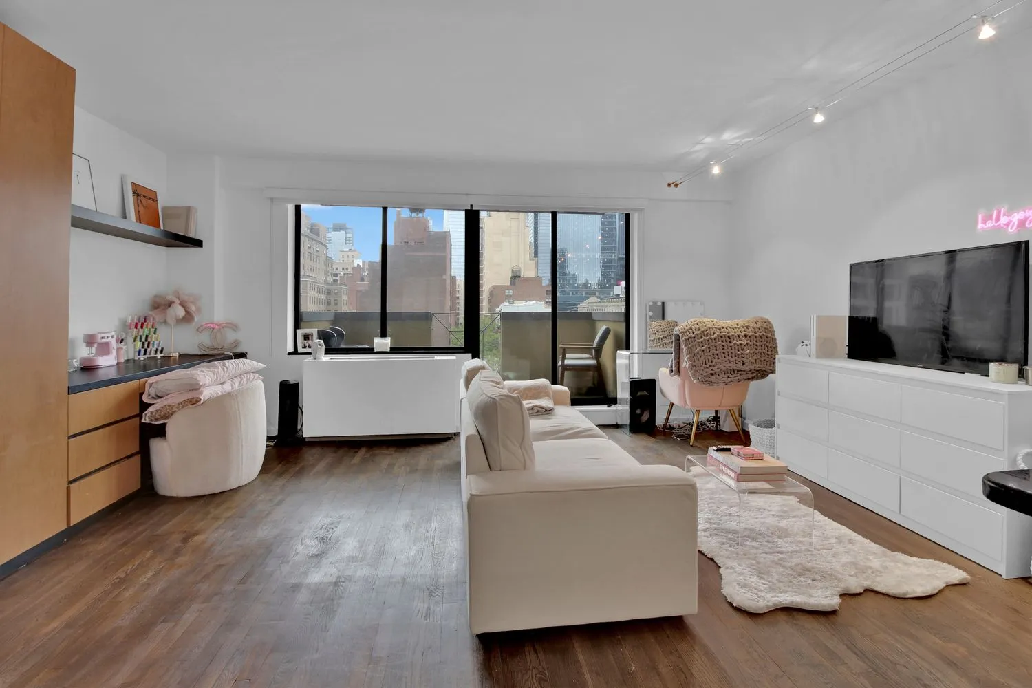 a living room with furniture and a flat screen tv