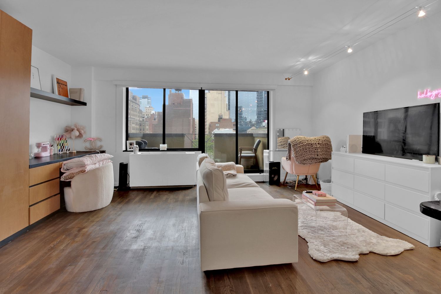 a living room with furniture and a flat screen tv