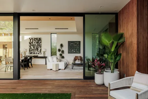 a view of a backyard with sitting area