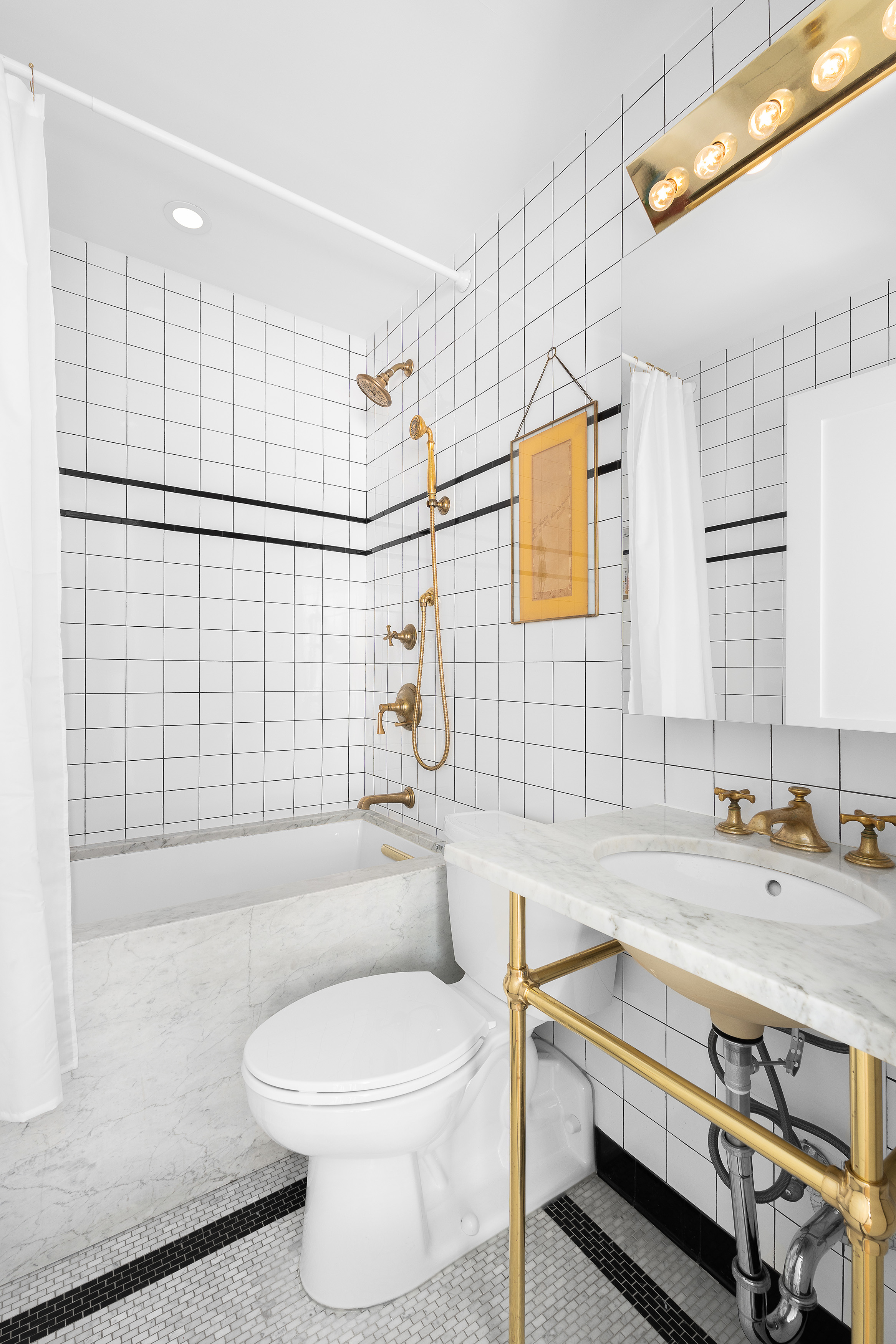 77 Bleecker Street, Unit 123E Manhattan, NY 10012 - Photo 10 of 13 a bathroom with a sink a toilet and shower