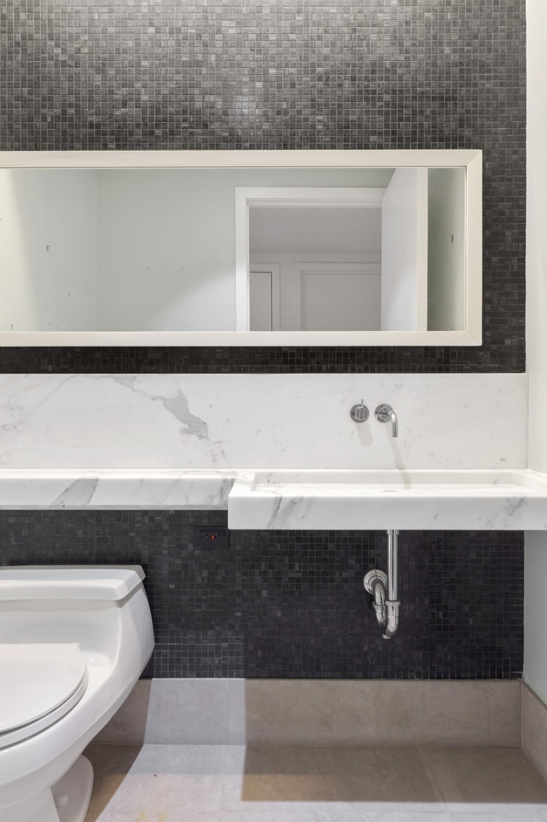 150 Nassau Street, Unit 11B Manhattan, NY 10038 - Photo 10 of 17 a bathroom with a sink and a toilet