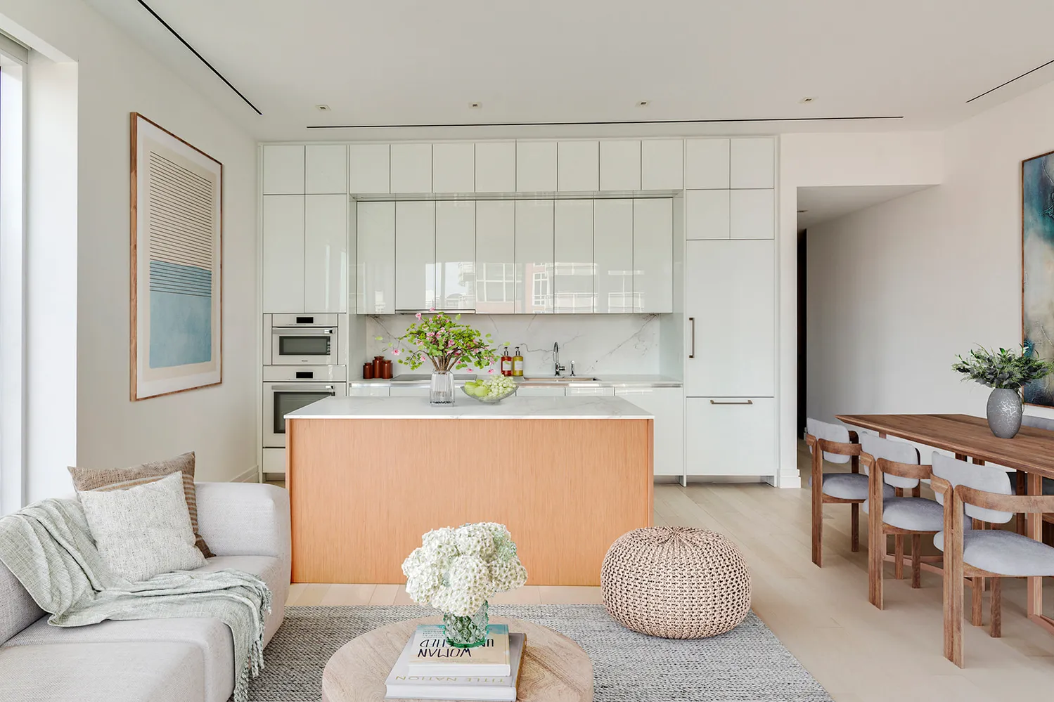 a living room with furniture a couch and a potted plant