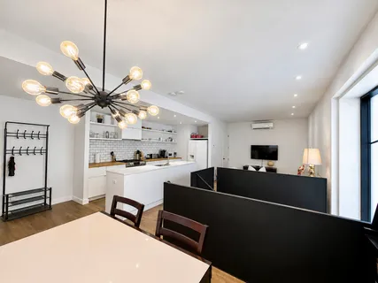 a kitchen with a sink appliances and cabinets