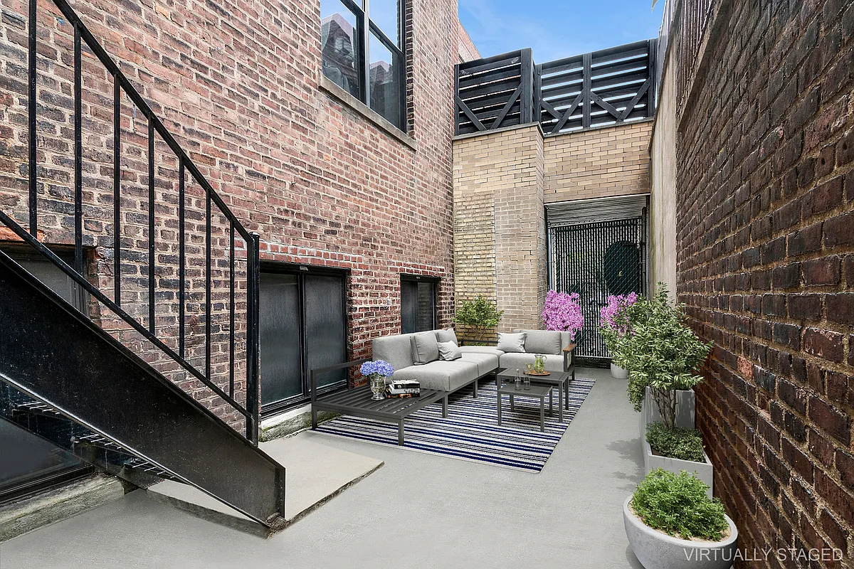 180 Bainbridge Street, Unit 109 Brooklyn, NY 11233 - Photo 4 of 20 a view of a patio with couches and potted plants