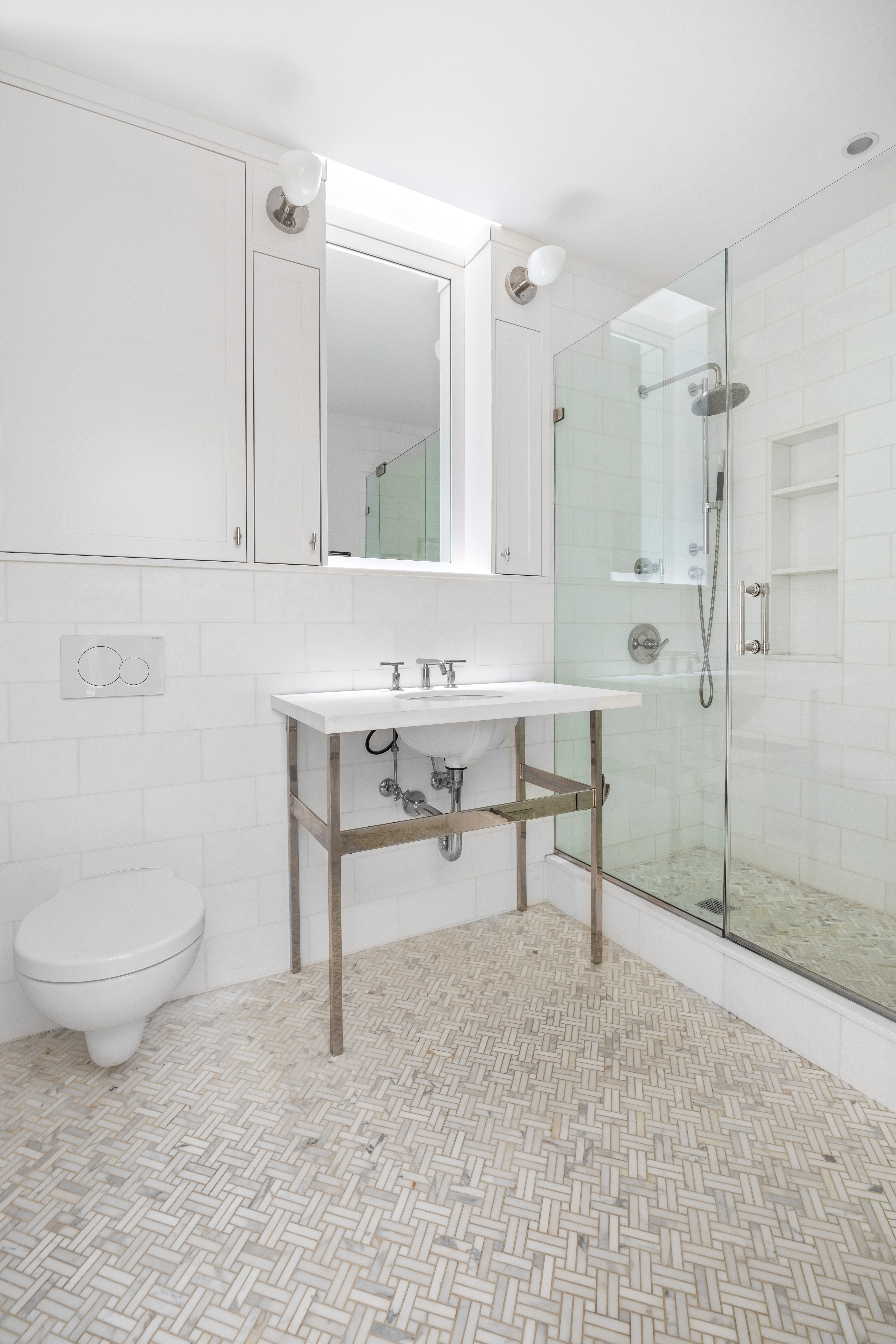 387 Union Street, Unit 2 Brooklyn, NY 11231 - Photo 11 of 12 a bathroom with a toilet a sink a mirror and shower