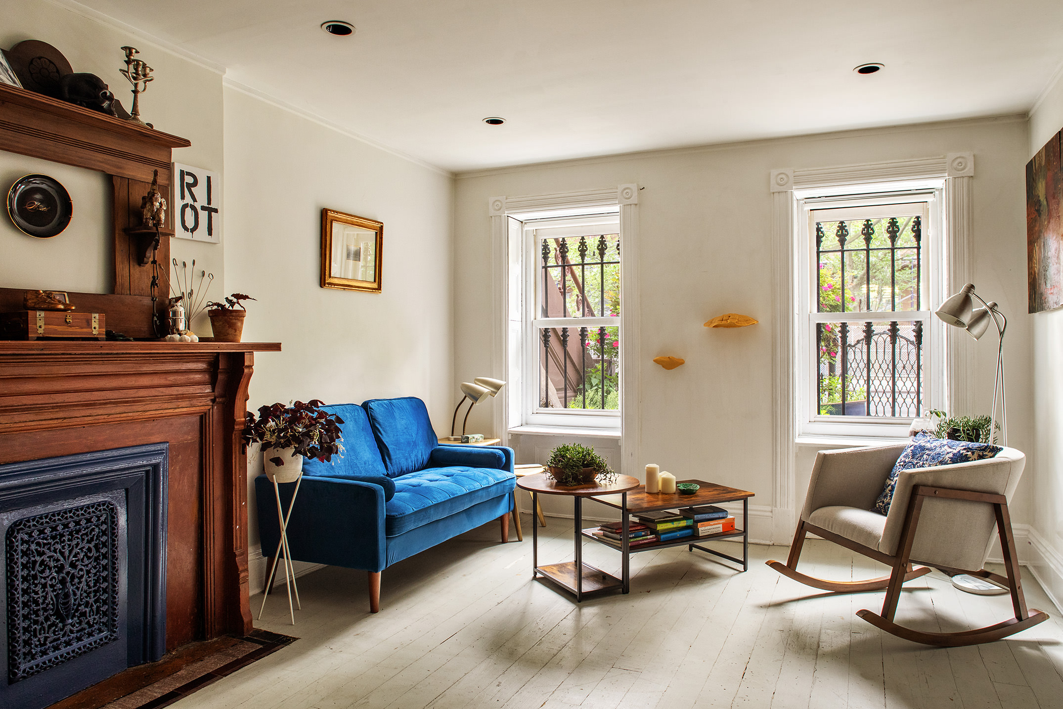 183 Halsey Street Brooklyn, NY 11216 - Photo 18 of 23 a living room with furniture and a fireplace