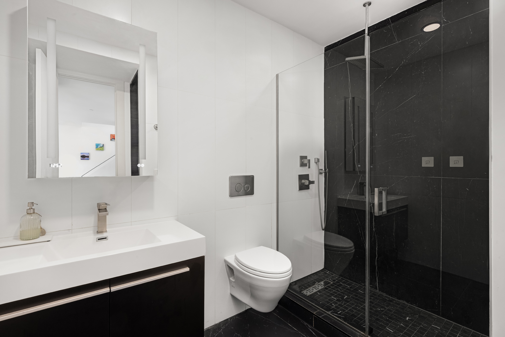 43 Newel Street, Unit PH2 Brooklyn, NY 11222 - Photo 6 of 10 a bathroom with a sink toilet and shower