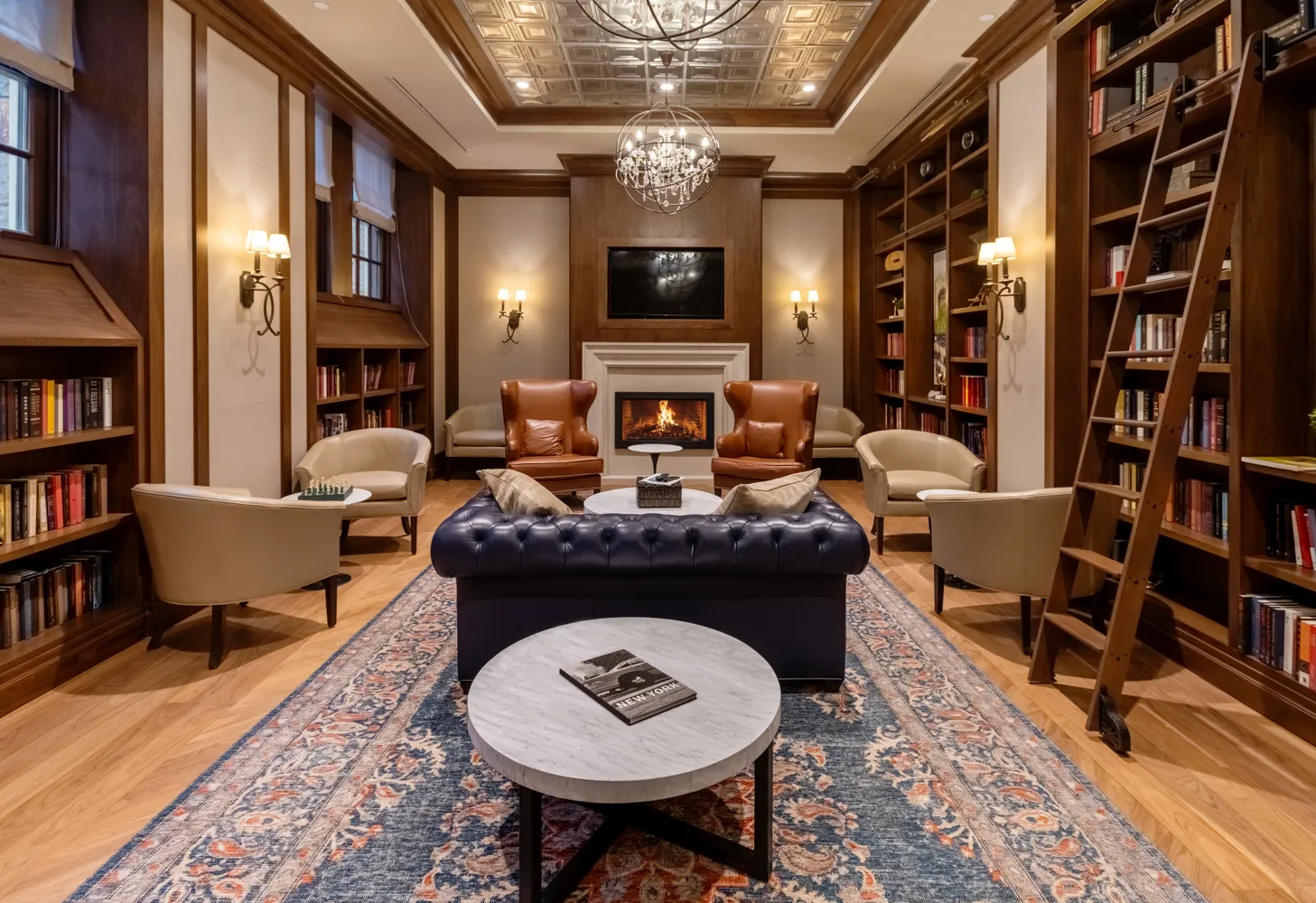 a living room with furniture and a bookshelf