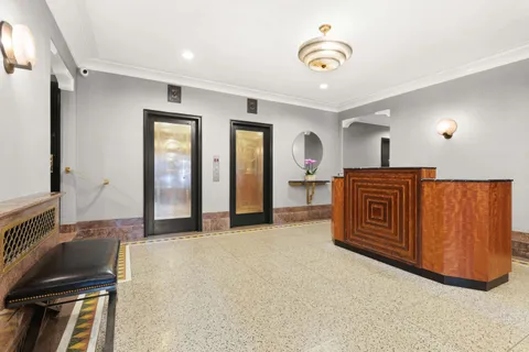 a view of an empty room with a fireplace