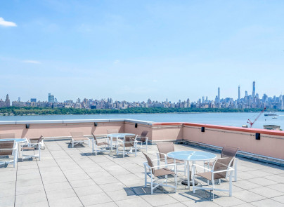 310 Hudson Park Edgewater, NJ 07020 - Photo 5 of 6 a view of a lake with outdoor seating and city view