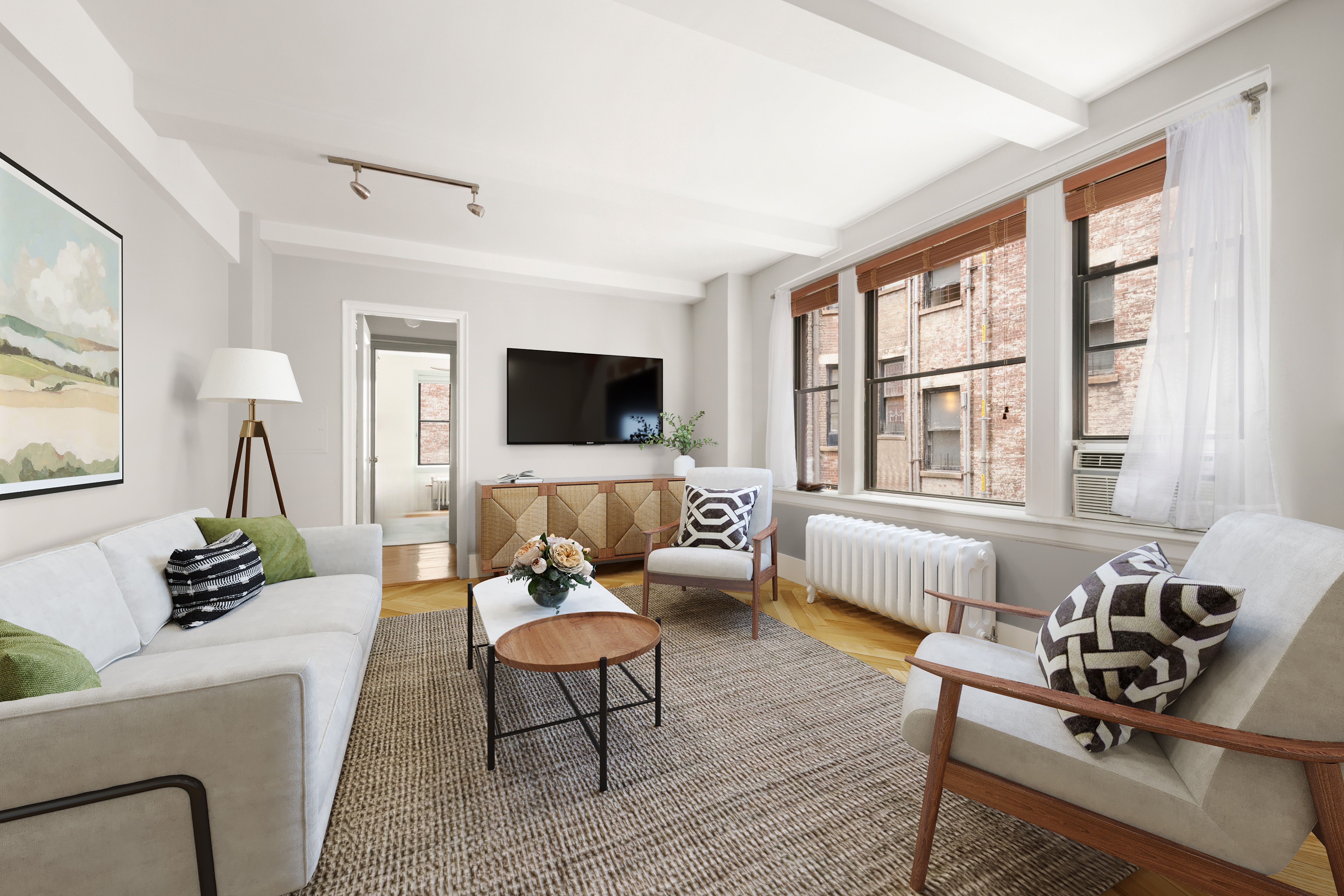 45 5th Avenue, Unit 9D Manhattan, NY 10003 - Photo 1 of 7 a living room with furniture wooden floor and a flat screen tv