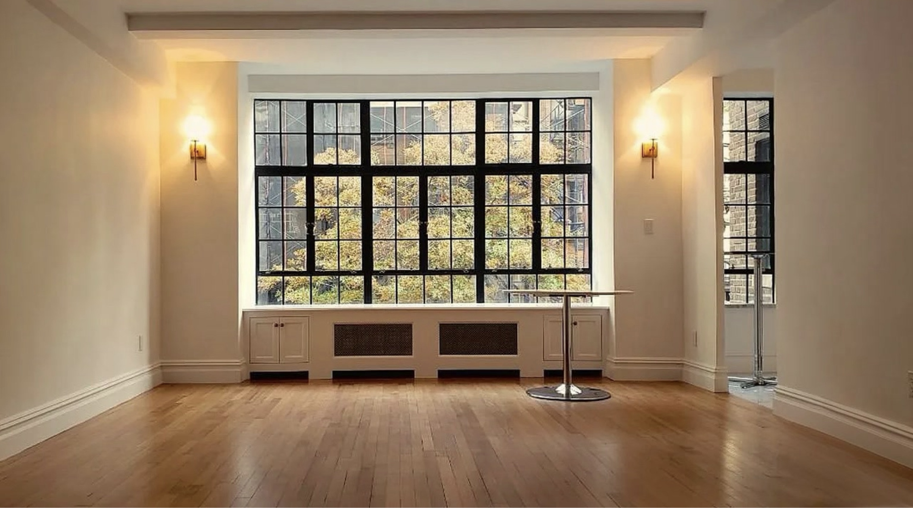 230 East 50th Street, Unit 3B Manhattan, NY 10022 - Photo 11 of 21 an empty room with windows