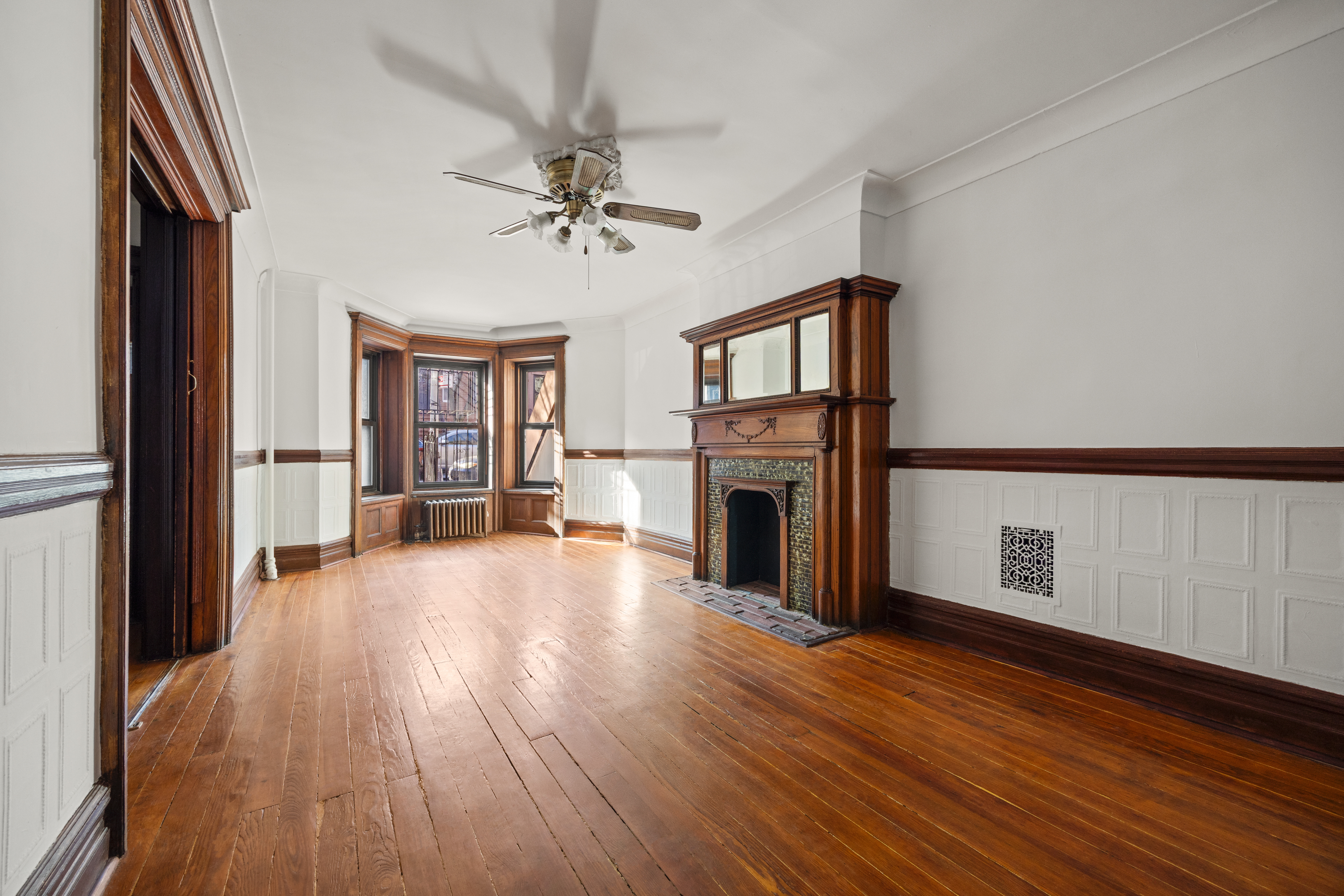 415 5th Street, Unit 1 Brooklyn, NY 11215 - Photo 6 of 14 a view of empty room with fireplace and wooden floor