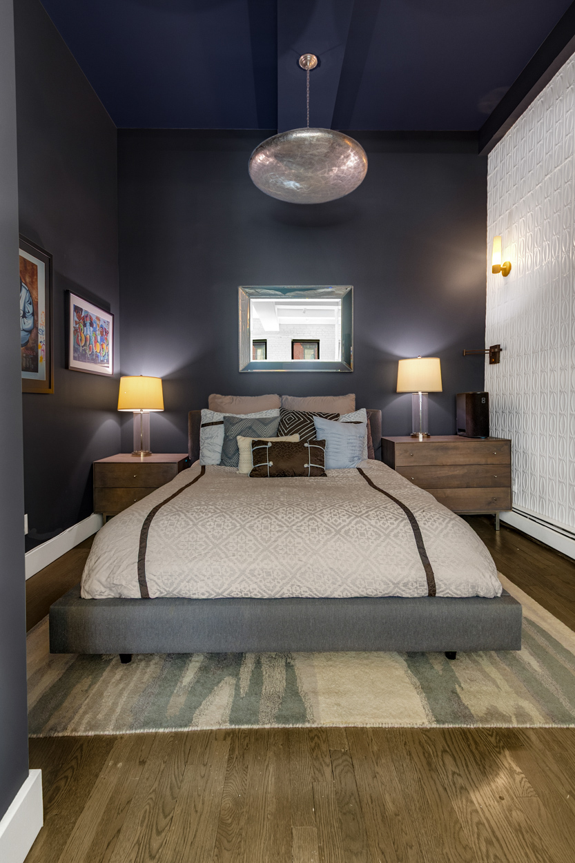 521 West 47th Street, Unit 3A Manhattan, NY 10036 - Photo 7 of 14 a bedroom with a bed and a lamp