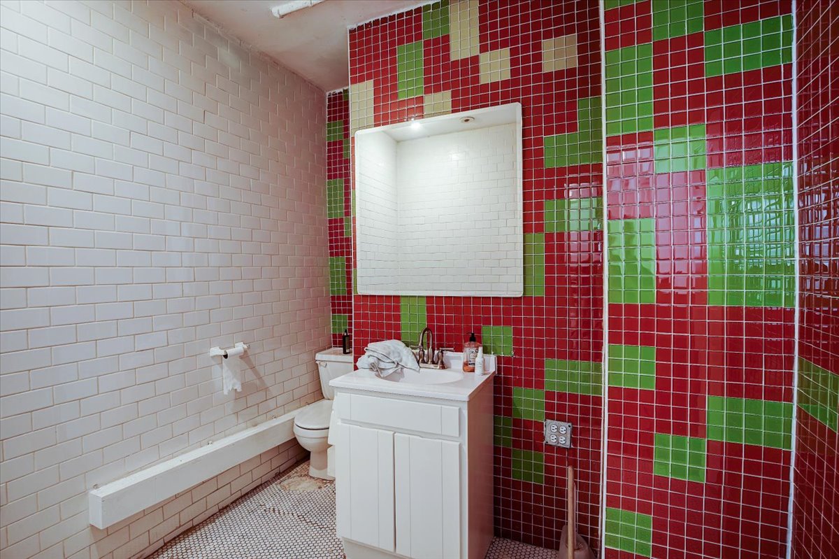 146 West 29th Street, Unit 9W Manhattan, NY 10001 - Photo 7 of 10 a bathroom with a sink toilet and shower