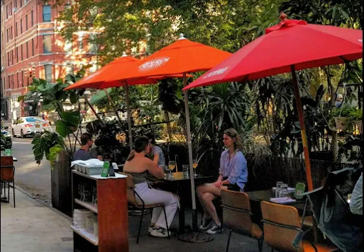 a view of a chairs and tables in a patio