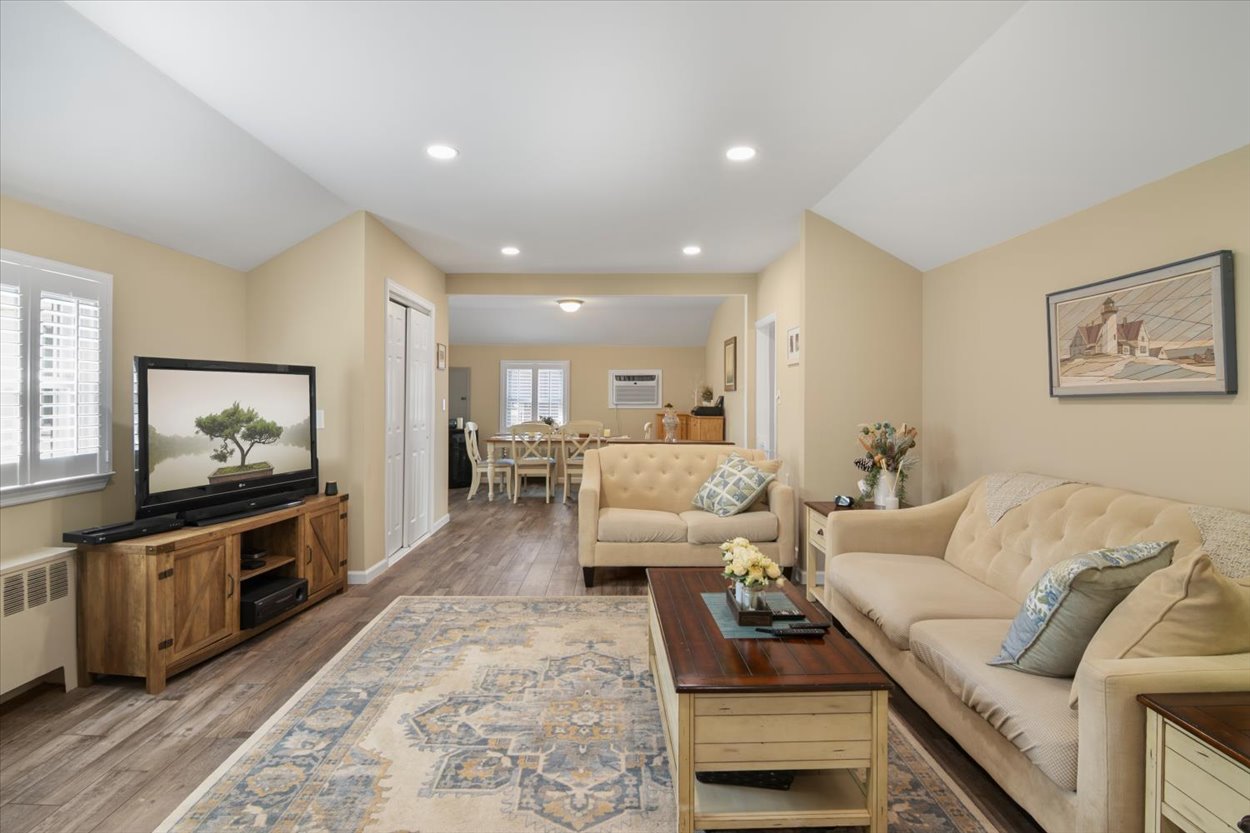 107 Kingston Road Parsippany, NJ 07054 - Photo 13 of 43 a living room with furniture and a flat screen tv