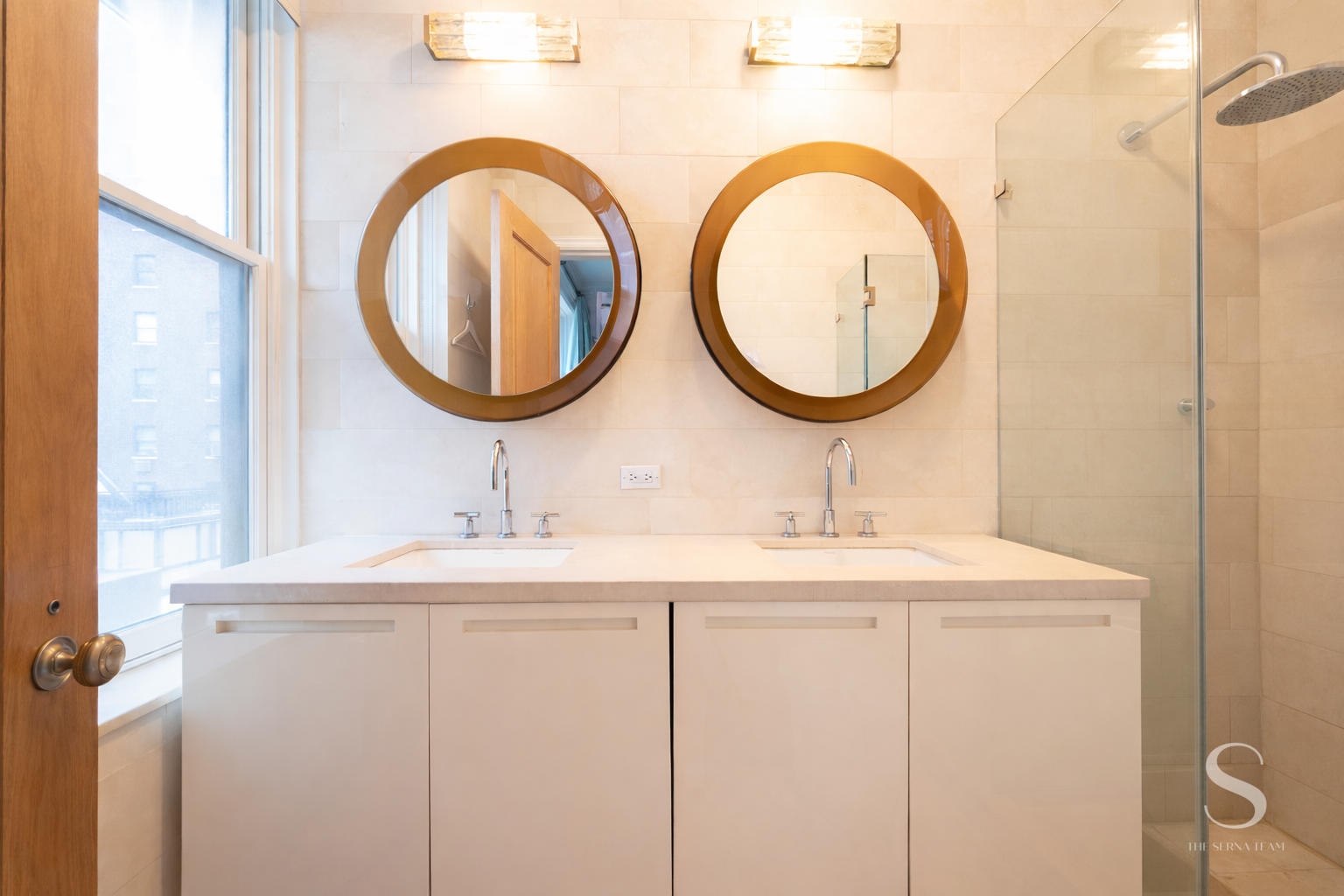 525 Park Avenue, Unit 7AB Manhattan, NY 10065 - Photo 10 of 13 a bathroom with a sink and a mirror