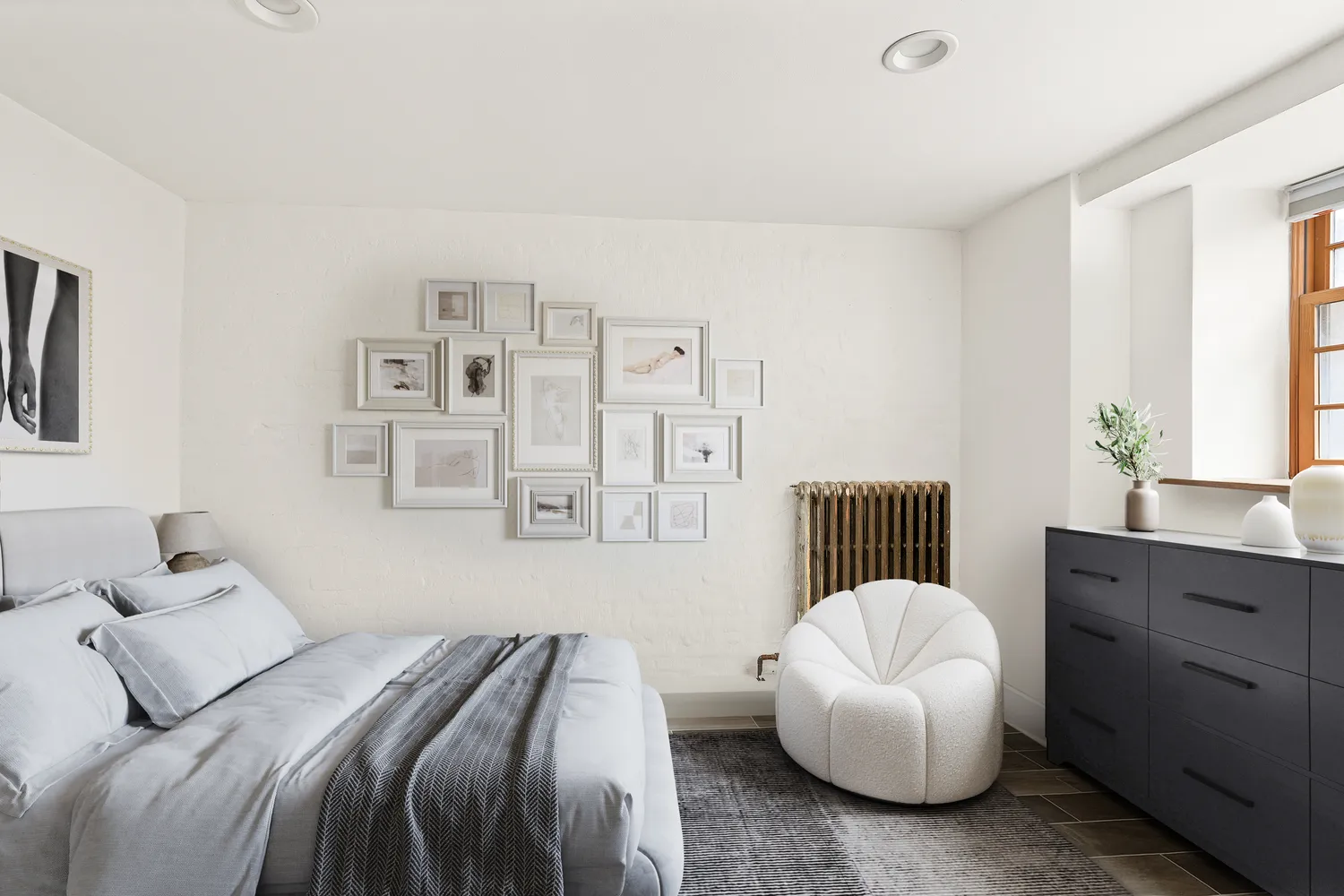 a bedroom with a bed and a chair