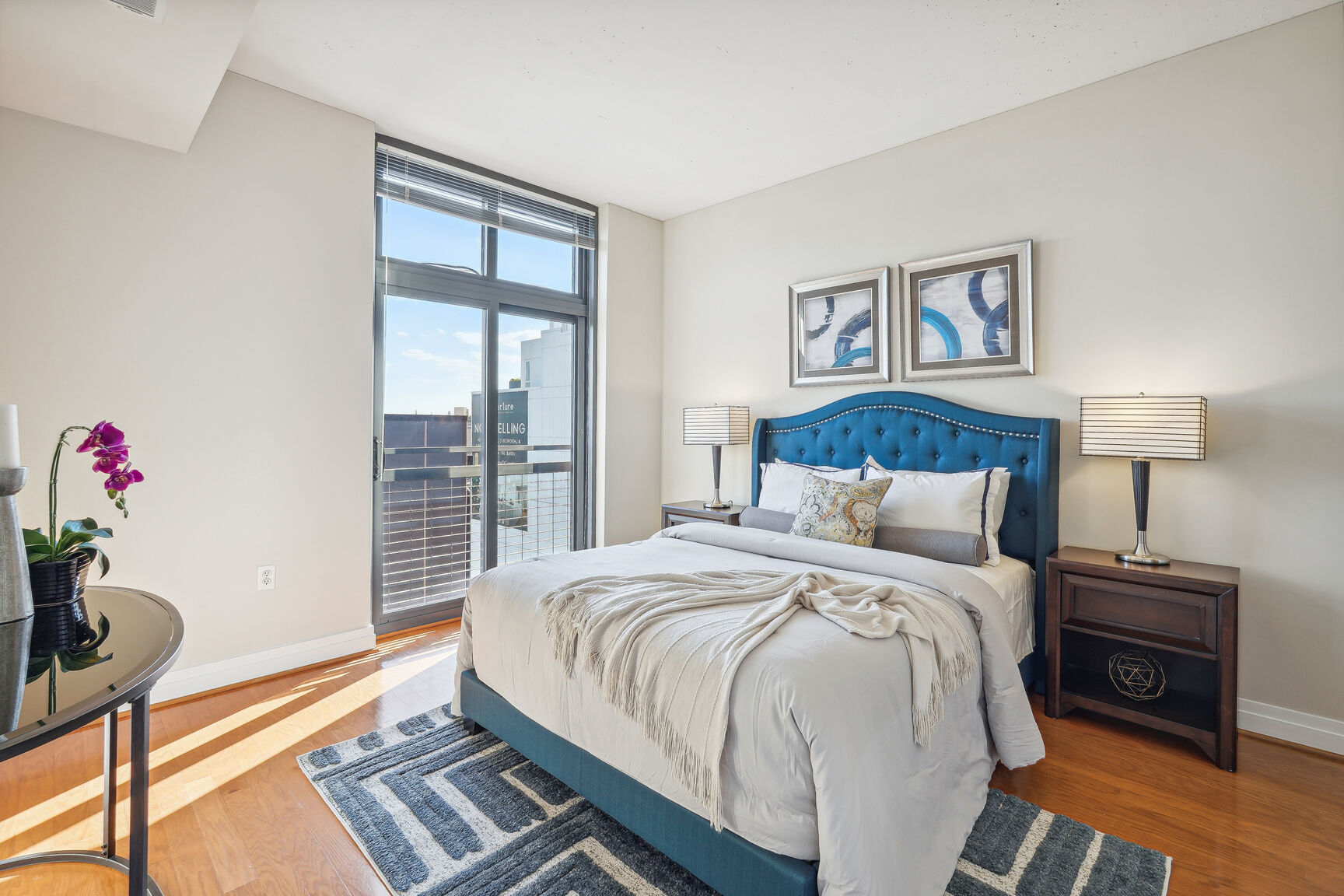 2120 Vermont Avenue Northwest, Unit 620 Washington, DC 20001 - Photo 17 of 61 a bedroom with a bed and wooden floor