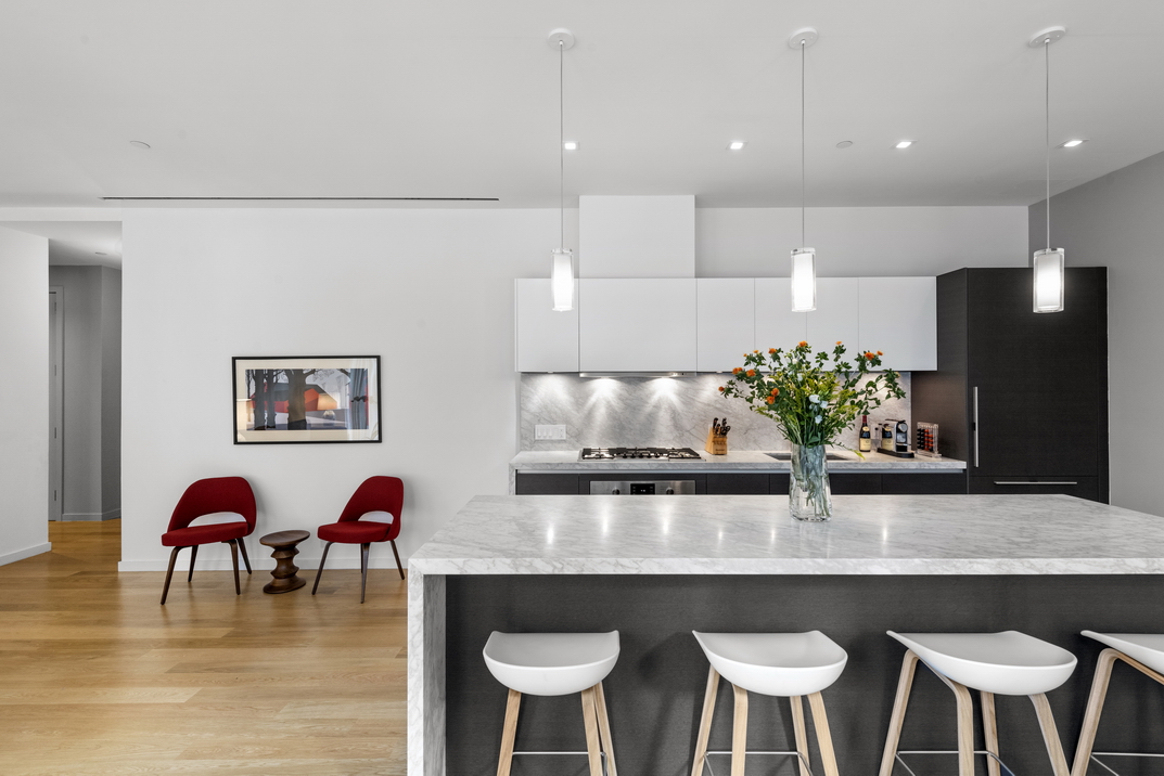 a view of kitchen with dining table and chairs