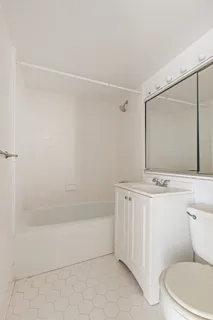 a bathroom with a sink a toilet and vanity