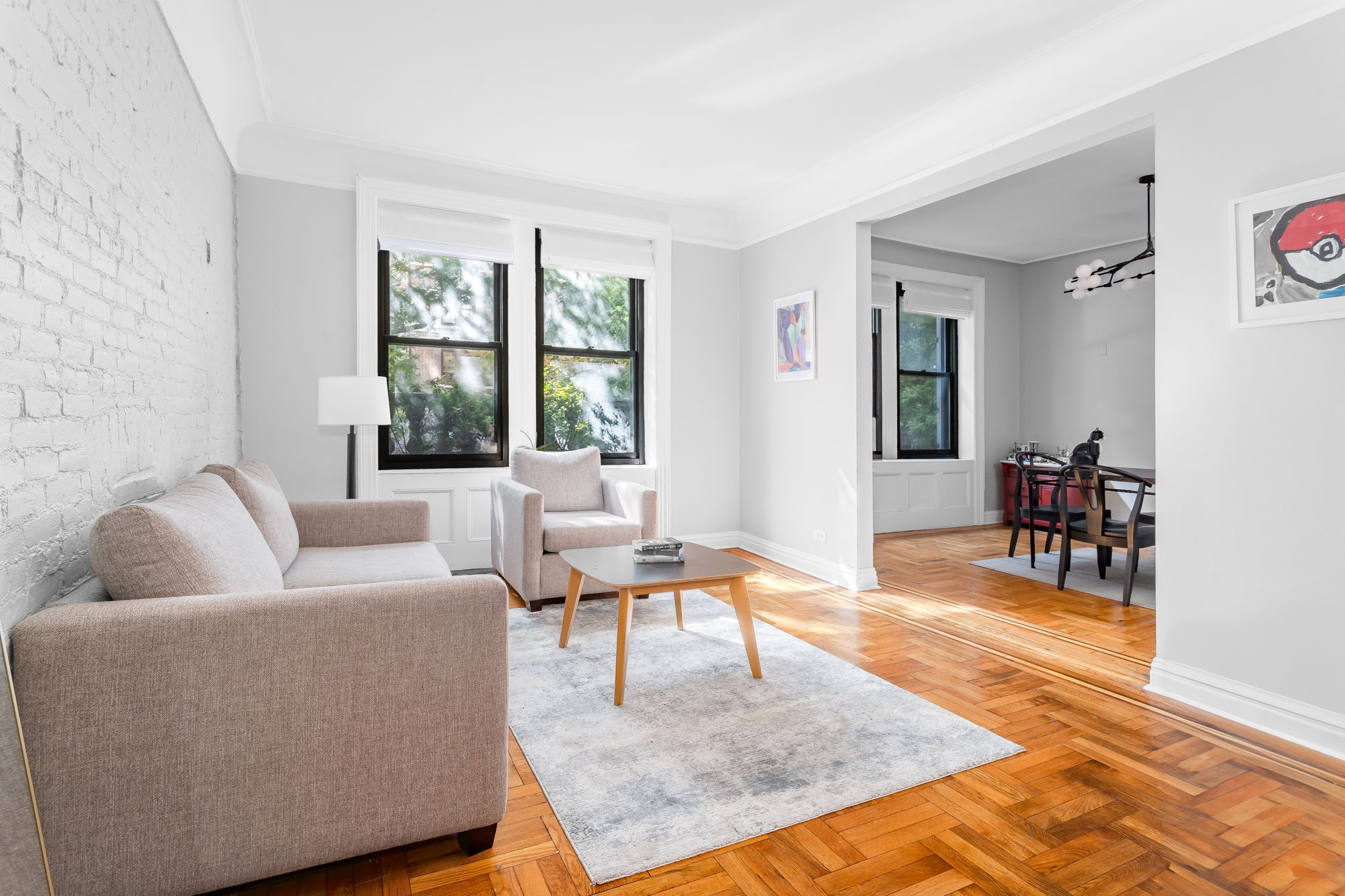 61 East 86th Street, Unit 25 Manhattan, NY 10028 - Photo 1 of 9 a living room with furniture and a rug