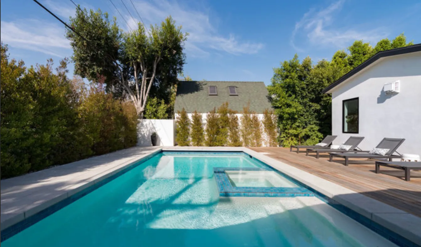 a view of swimming pool with lounge chair