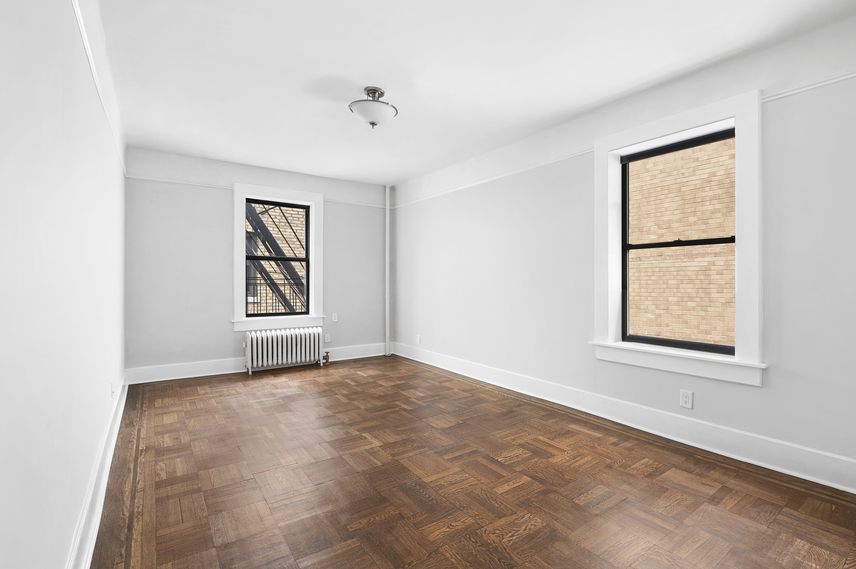 371 Fort Washington Avenue, Unit 4B Manhattan, NY 10033 - Photo 11 of 14 an empty room with windows and closet