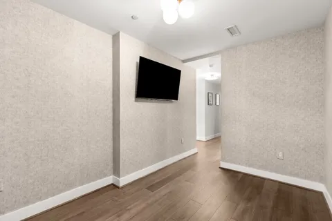 a view of a livingroom with wooden floor