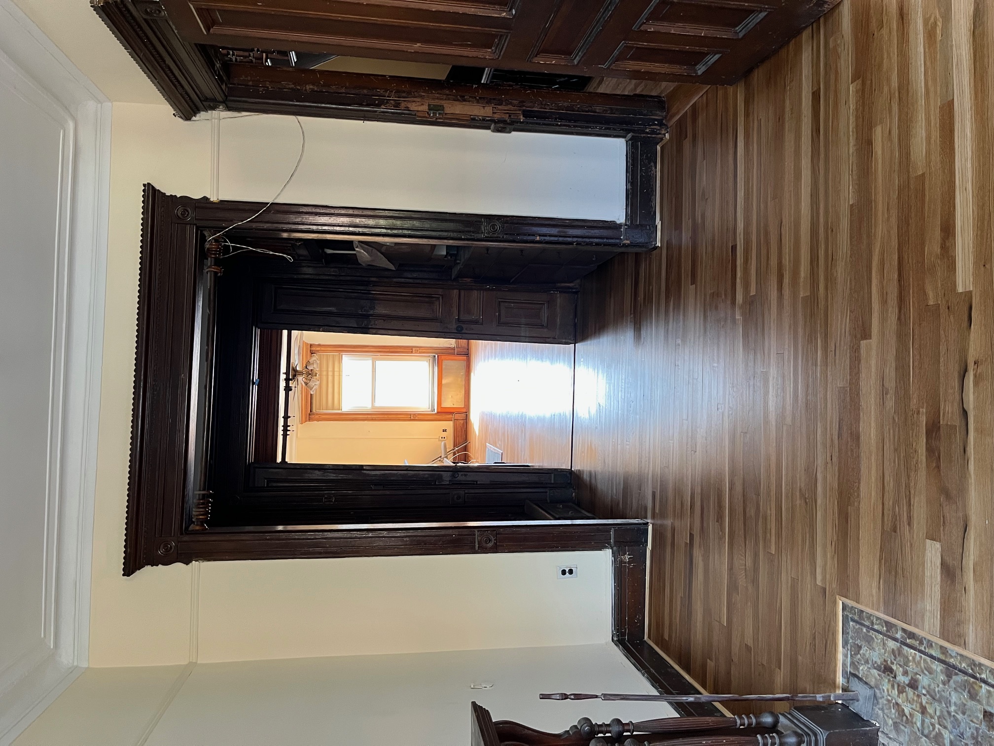 106 West 131st Street Manhattan, NY 10027 - Photo 10 of 16 a view of hallway with wooden floor and stairs