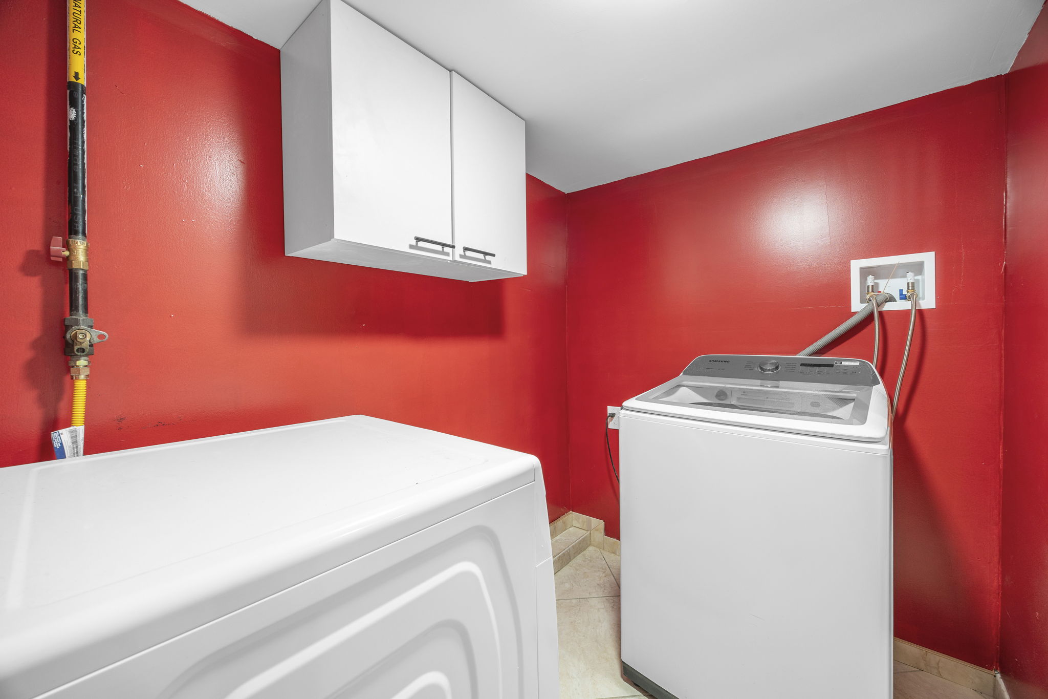 25-69 46th Street Queens, NY 11103 - Photo 30 of 33 a utility room with dryer and washer