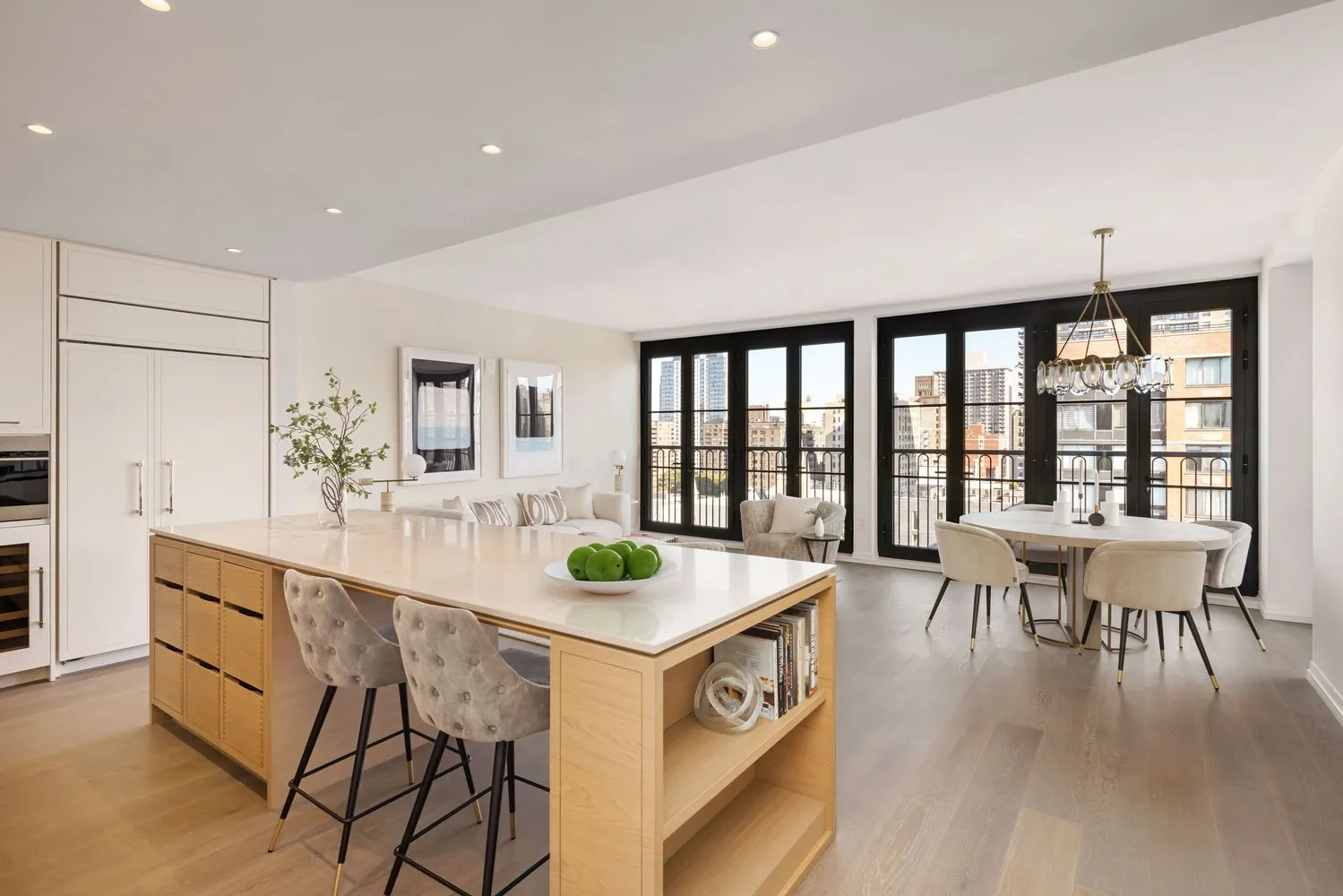 a kitchen with a table chairs and a wooden floor