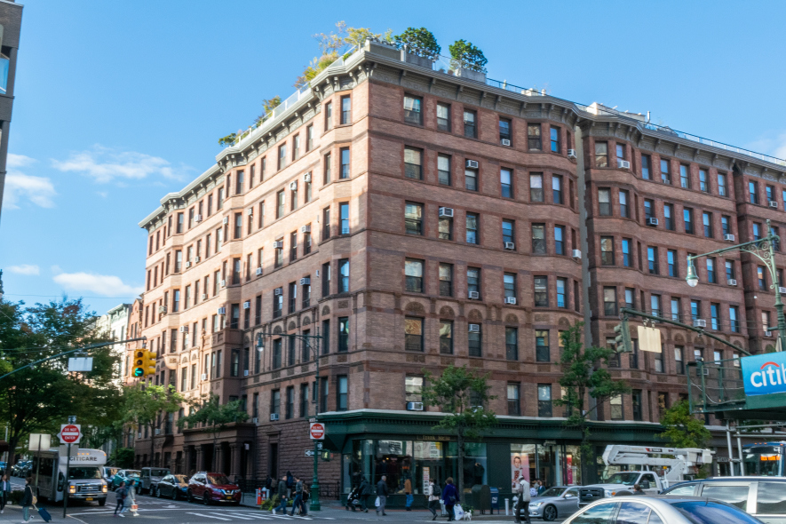 101 West 81st Street, Unit 601 Manhattan, NY 10024 - Photo 10 of 12 a front view of a building with lot of cars and trees