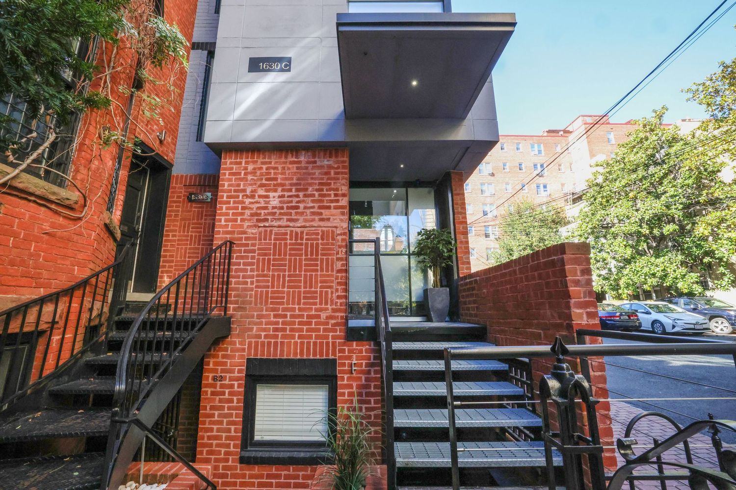 1630 19th Street Northwest, Unit C Washington, DC 20009 - Photo 2 of 45 an outdoor view of a building with wooden floor and fence