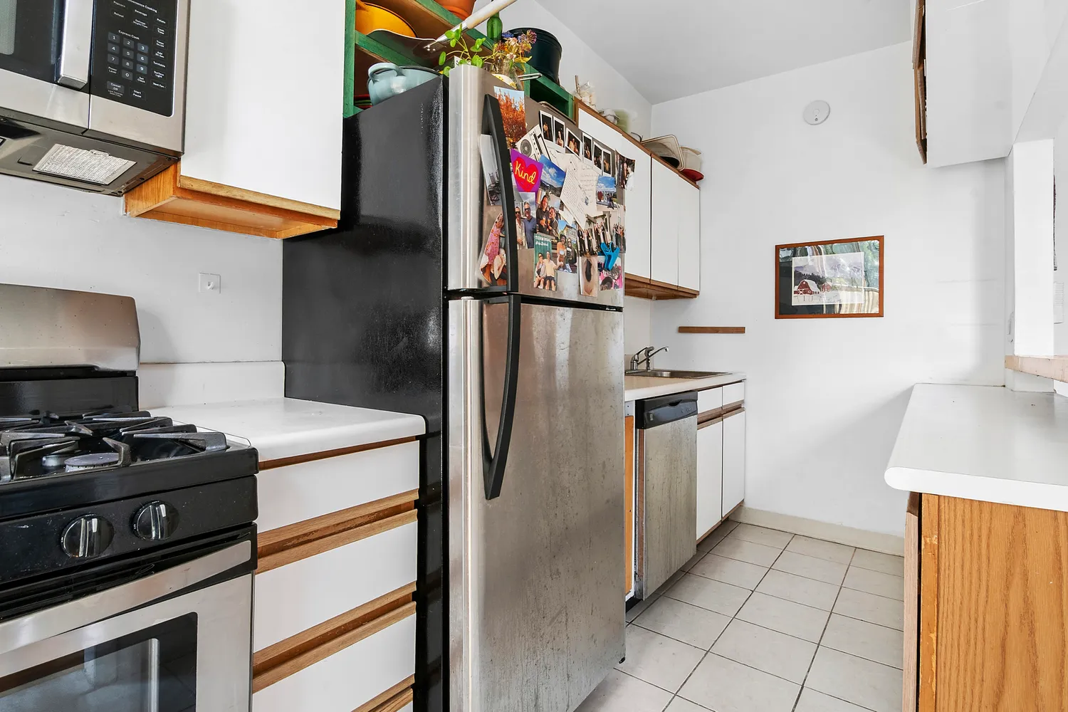 a kitchen with stainless steel appliances granite countertop a stove and a refrigerator